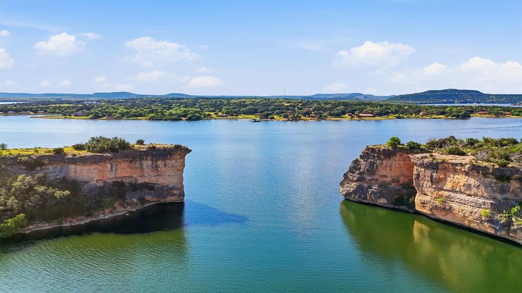 Great room with floor-to-ceiling lake views over Possum Kingdom